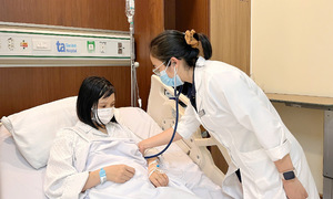 Thai phụ tràn dịch tim phổi do lupus ban đỏ hệ thống