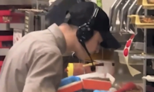 Fast food worker fired for spitting in customer's burger