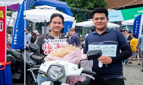 Thousands of Ho Chi Minh City residents trade gas-powered scooters for electric ones