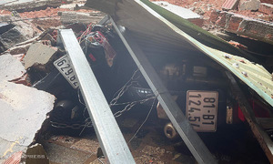 Bus station wall collapses onto adjacent home