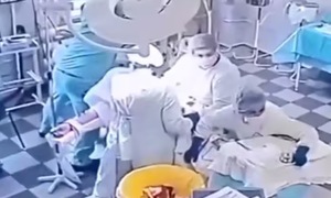 Russian doctors embrace patient during 8.8 magnitude earthquake