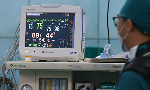Doctors battle to save a young woman from a mysterious illness