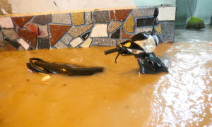 Motorbikes submerged in Ho Chi Minh City after heavy rain