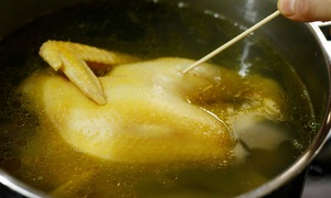 Why prick the thigh of a boiled chicken?