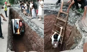 Robotaxi plunges into construction pit with passenger aboard