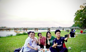 Hue's riverside lawns draw crowds seeking cool breezes and sunset views