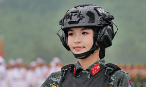 Female troops march in rehearsal for national day parade