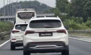 Driver fined for 'Happy Wedding' license plate cover