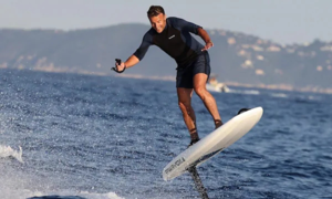 French president praised for 'handsome, stylish' surfing