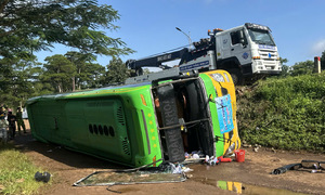 Passenger bus overturns on highway