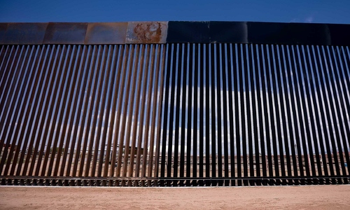 Trump orders border wall painted black