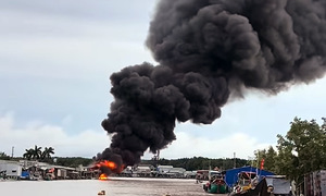 Man detains after allegedly attacking partner and setting market ablaze