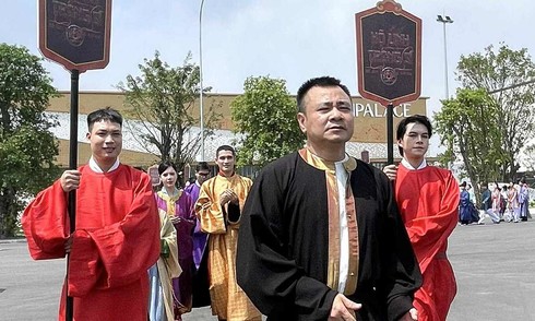 Artist Tu Long parades with 'Guardians of the Royal Tomb' film crew