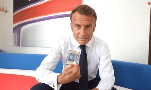 French president delights fans by showing off 'blue-eyes white dragon' card