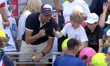 Millionaire condemned for snatching hat from child at US Open
