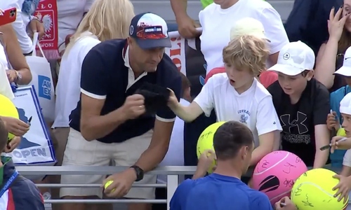 Millionaire condemned for snatching hat from child at US Open