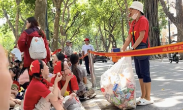 Woman's whistle calls for cleaner celebrations in Hanoi