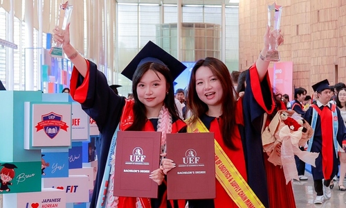 Twin sisters graduate top of their classes
