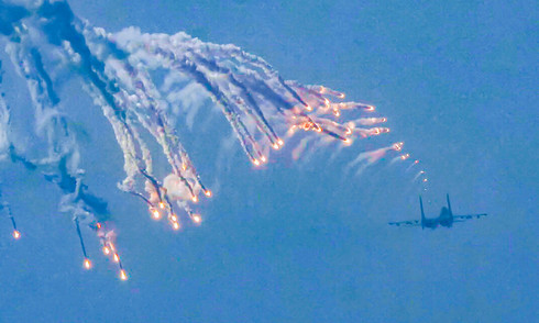 Su-30MK2 fighters release flares over Ba Dinh square