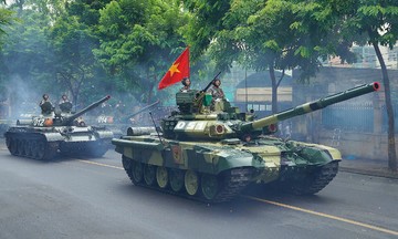 Armored vehicles participate in the A80 parade