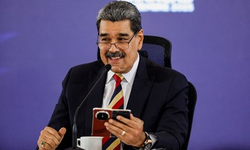 Venezuela's president shows off phone gifted by Xi