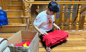 Red and gold star flags and shirts donated to highland children after national day