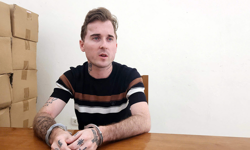 Foreign national threatens bar patron with handgun