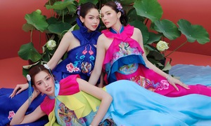Three Miss Vietnam titleholders pose in modernized Ao Dai