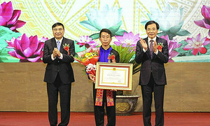 Village chief awarded labor medal for rescuing 90 people from flash flood