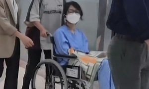 Former South Korean first lady appears in wheelchair, wearing ankle monitor