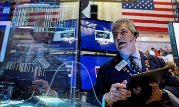 US stocks hit record highs, gold rebounds