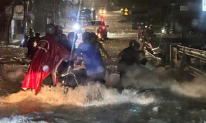Raging floodwaters sweep away motorcycles in Bien Hoa