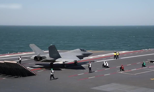 China showcases stealth fighter landing and taking off from aircraft carrier