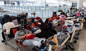 Travelers stranded at Hong Kong airport due to super typhoon Saola