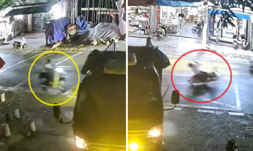Truck backing up throws motorcyclist onto the road