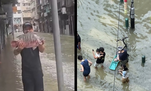Macau residents catch fish on flooded streets after Typhoon Ragasa