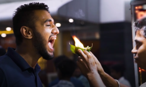 Customers try India's fire paan