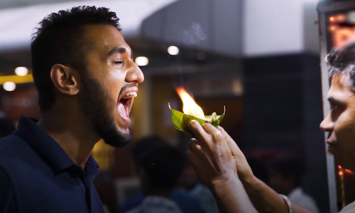 Customers try India's fire paan