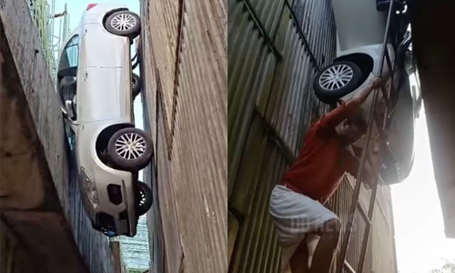 Car falls between two pillars of an under-construction overpass