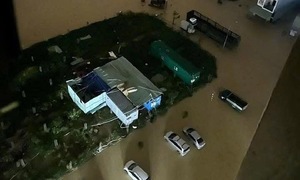 Quy Nhon residents call for help as floodwaters reach rooftops
