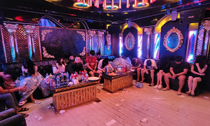 Police raid three karaoke bars, arrest 85 individuals
