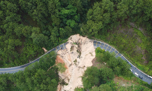Mimosa Pass road surface completely washed away, cutting off traffic