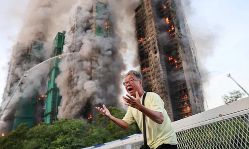 Hong Kong apartment fire: couple survives by using wet towels