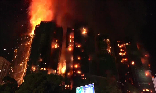 Hong Kong firefighters contain apartment fire over two days