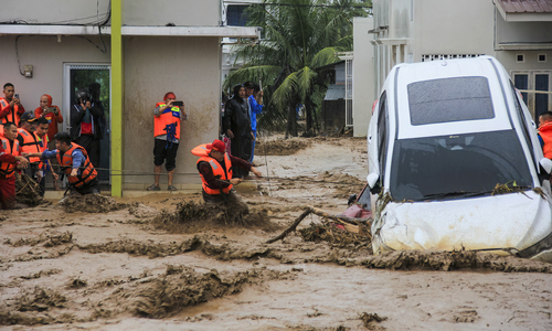 Floods sweep away homes in Indonesia, at least 84 dead