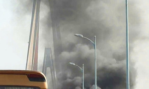 Car engulfed in flames on Rach Mieu bridge