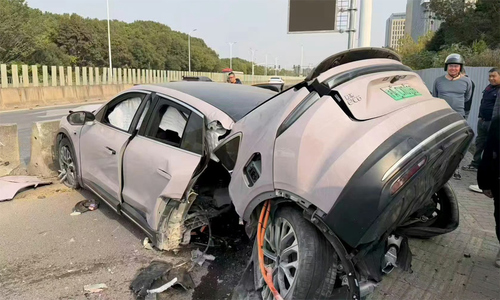 Electric car splits in half after crash, driver survives