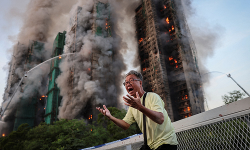 Photo becomes symbol of Hong Kong apartment fire