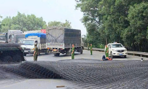 Tons of steel fall from container, hitting a couple on a motorbike