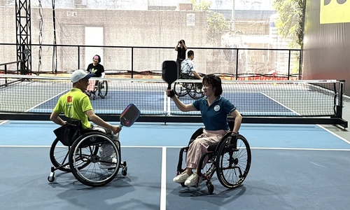 Playing pickleball in a wheelchair